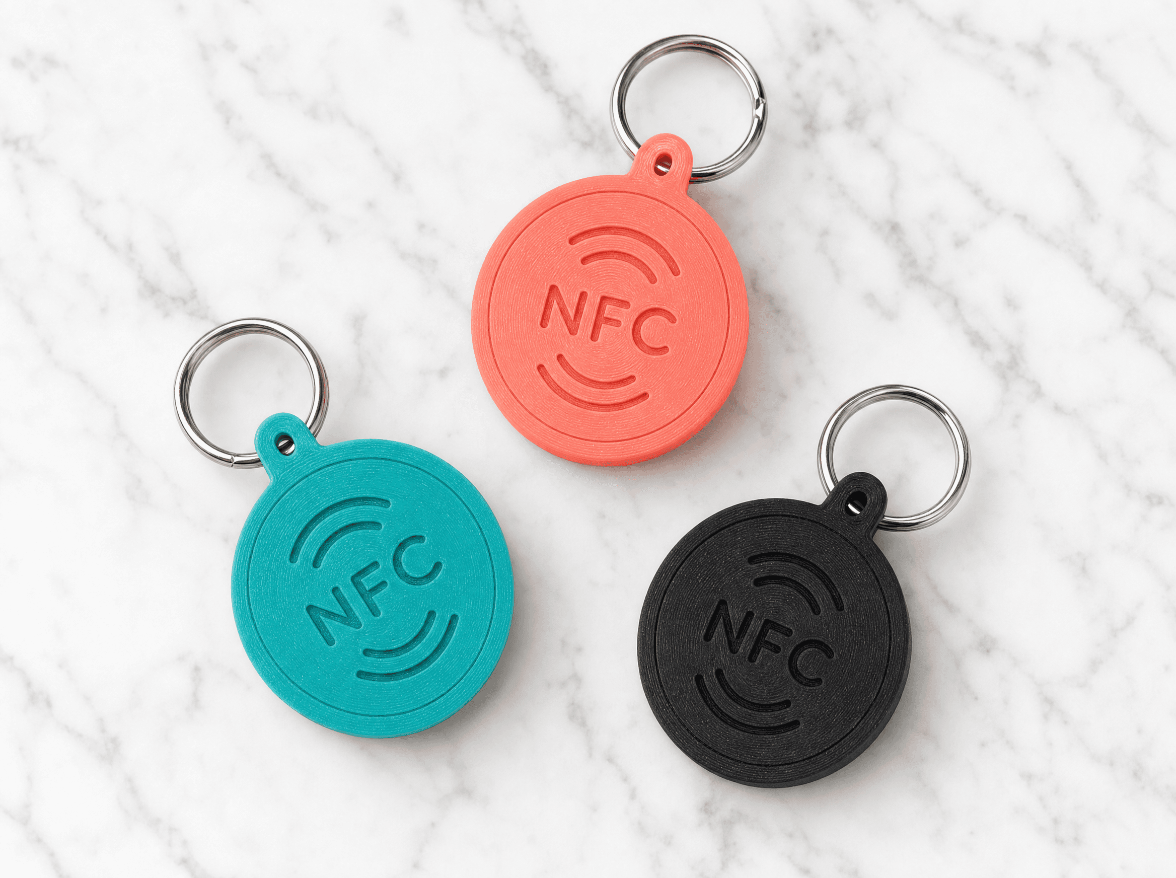 Multiple custom-designed Tapora NFC keychains in different colors - design your own