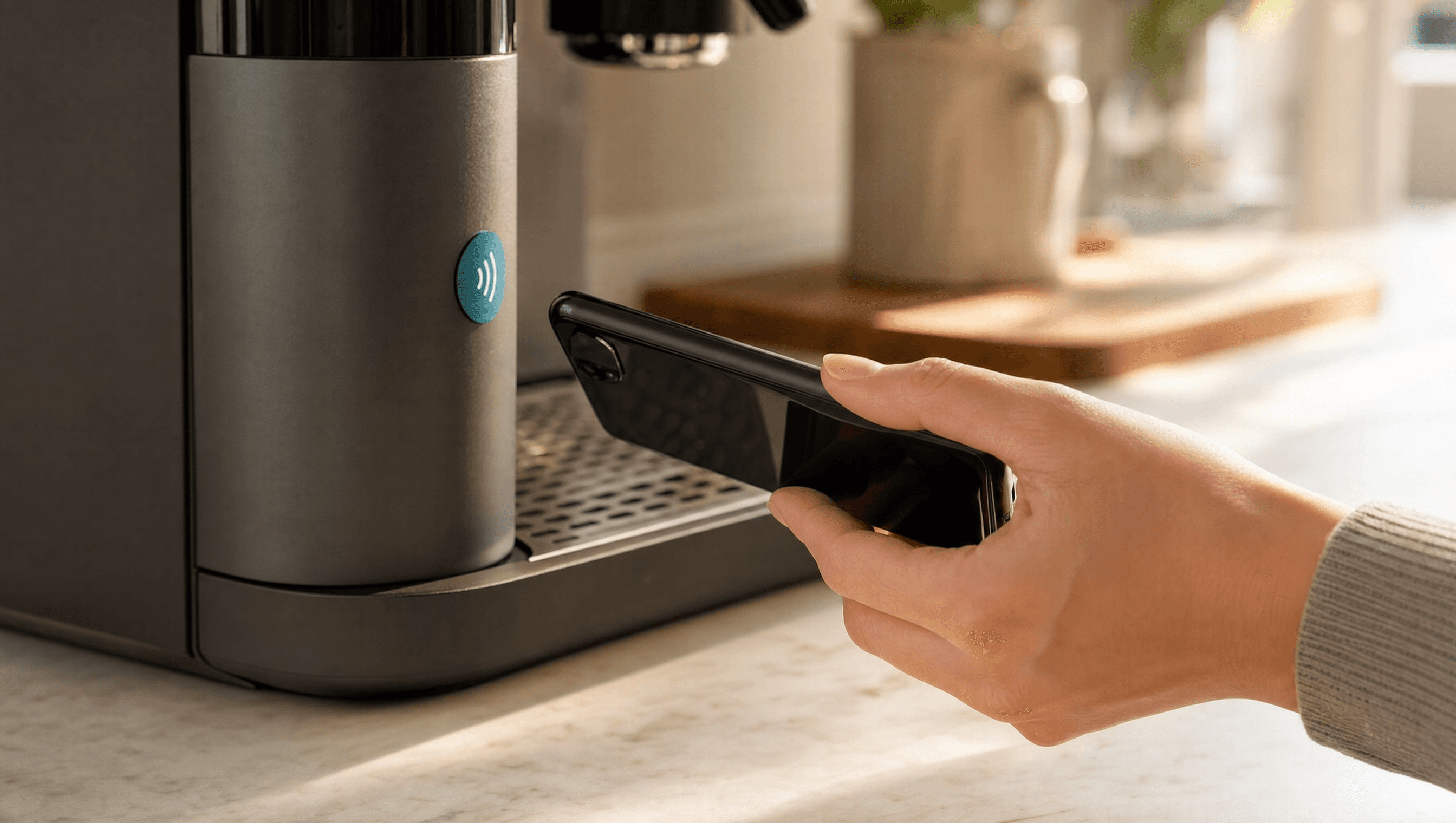 Person scanning NFC badge on appliance to access product instructions